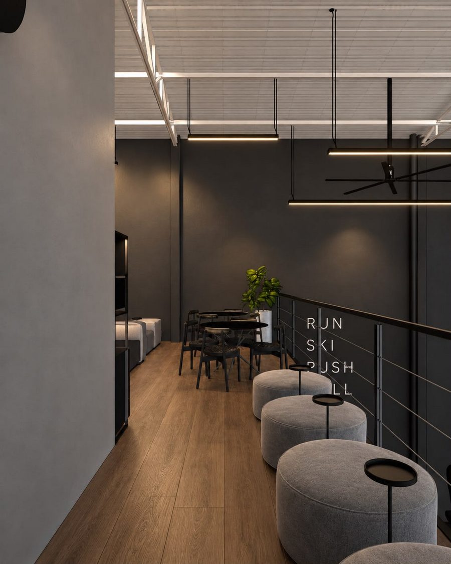 Lounge no mezanino com pufes e mesas